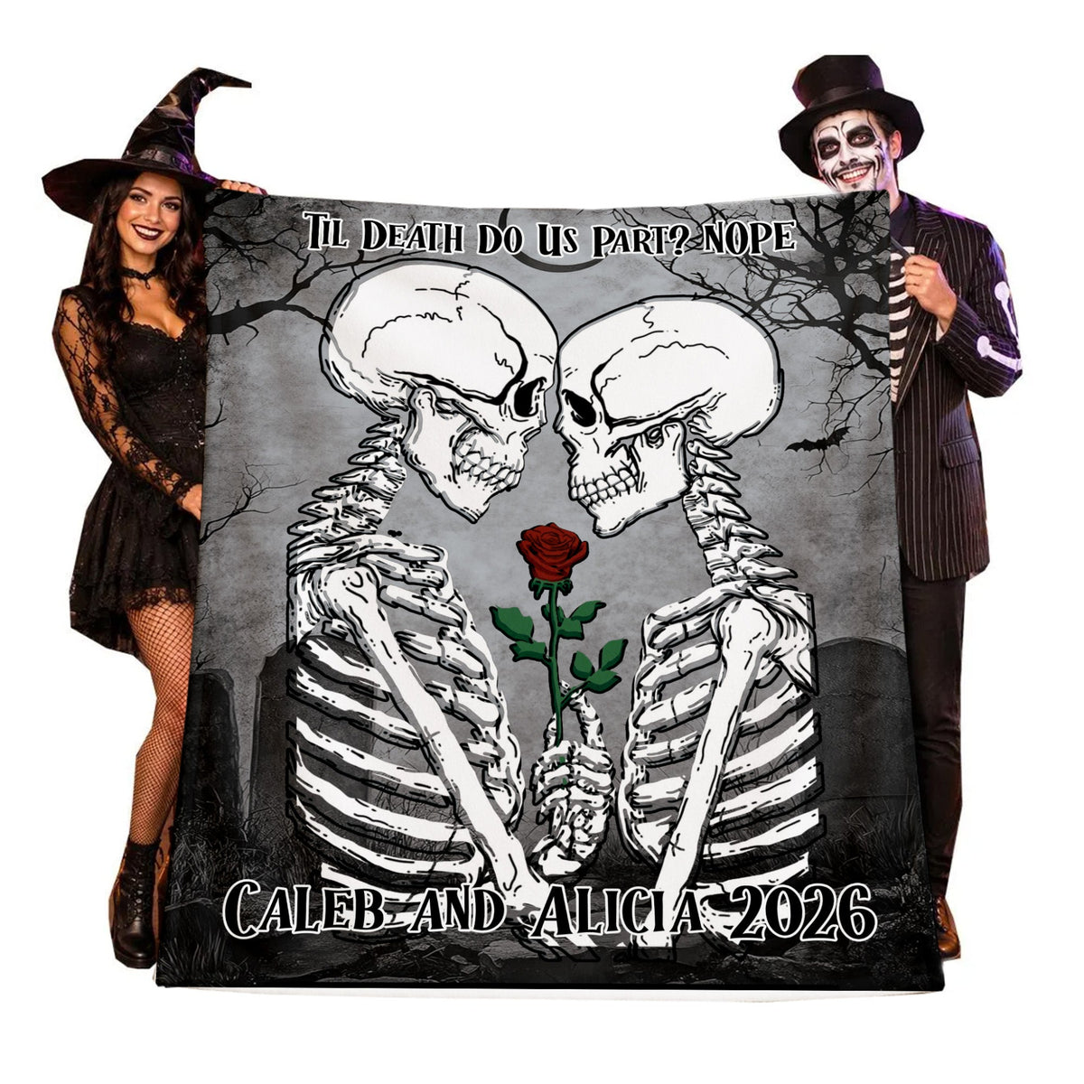 A custom printed blanket featuring two facing skeletons holding a red rose, with the text 'Till Death Do Us Part? Nope' and 'CALEB AND ALICIA 2026'. A woman in a witch costume holds the left side and a man in a skeleton costume holds the right side against a white background.
