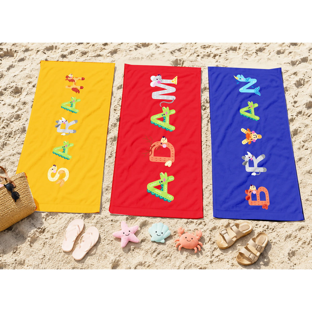 Pink towel with name willa spelled out in animal letters