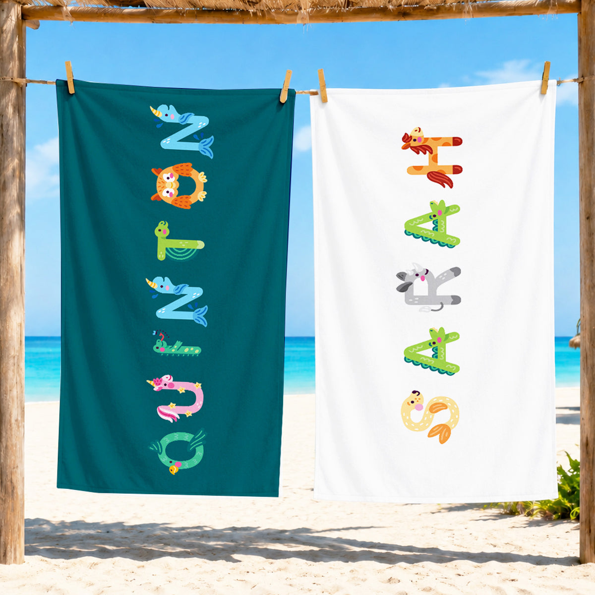 green towel and white towel with quinton and sarah spelled out in animal letters