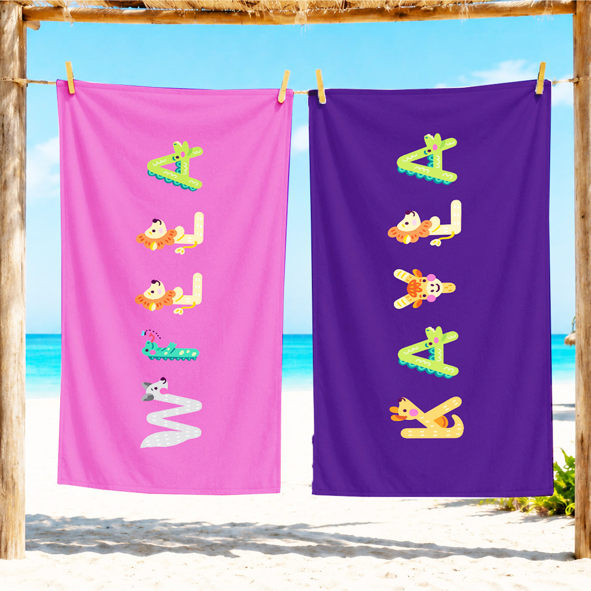 Pink towel with name willa spelled out in animal letters