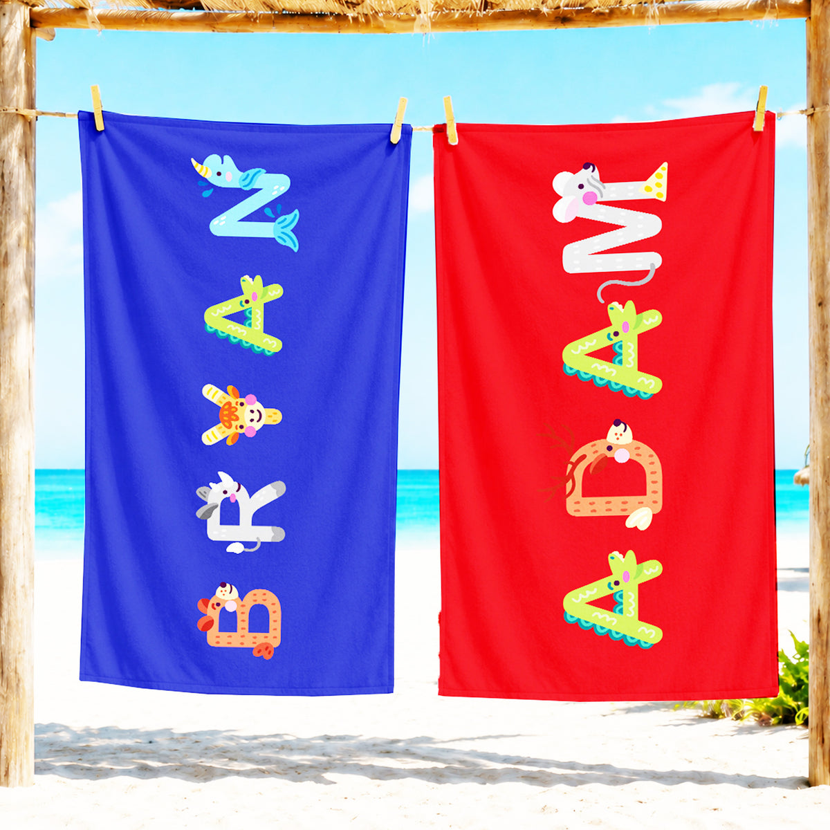 Pink towel with name willa spelled out in animal letters