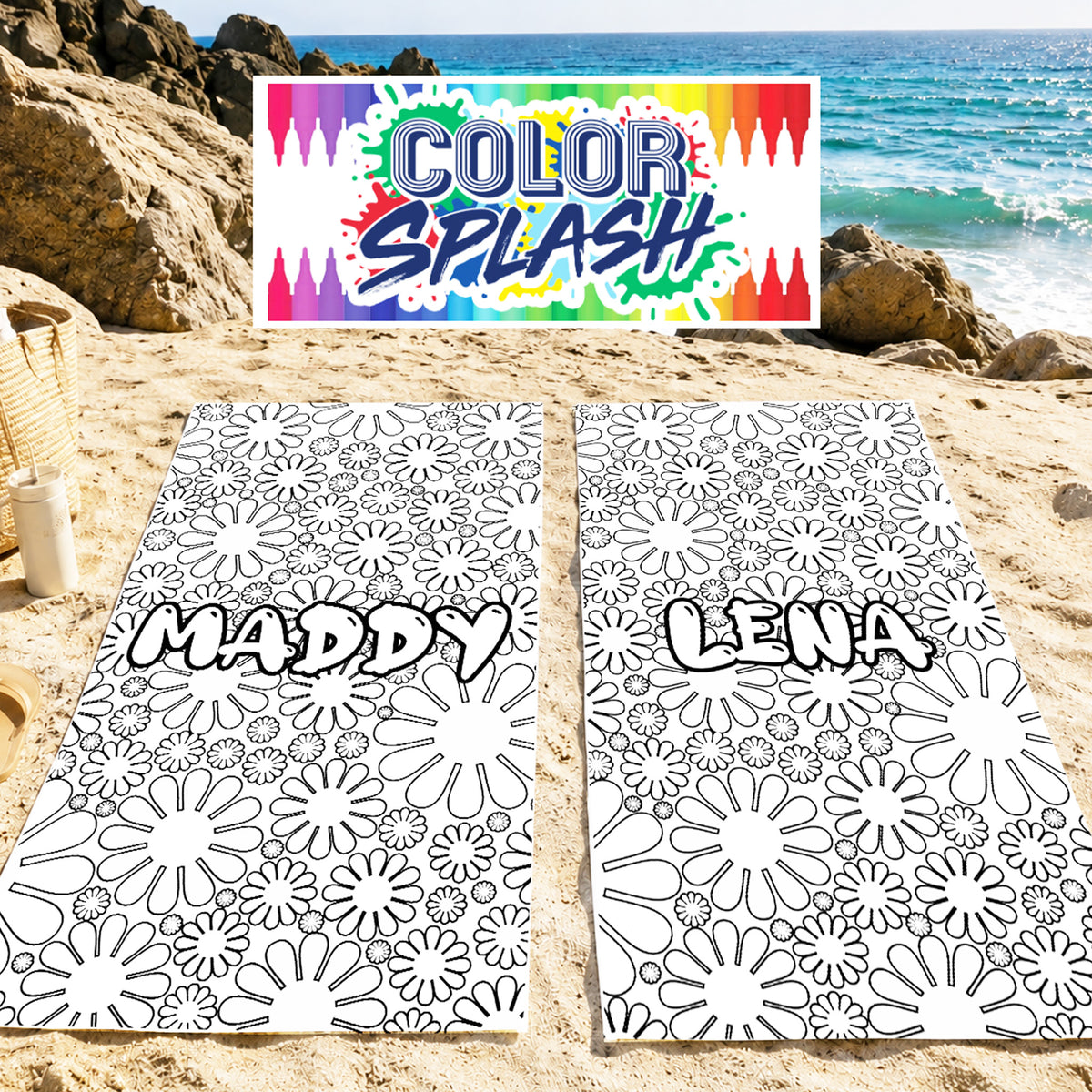 Two personalized beach towels laid out on sand at a beach, featuring a black and white floral line art pattern with the names 'MADDY' and 'LENA' printed across the center. A colorful 'COLOR SPLASH' banner is displayed above the towels, and a beach scene with rocks and ocean is in the background.