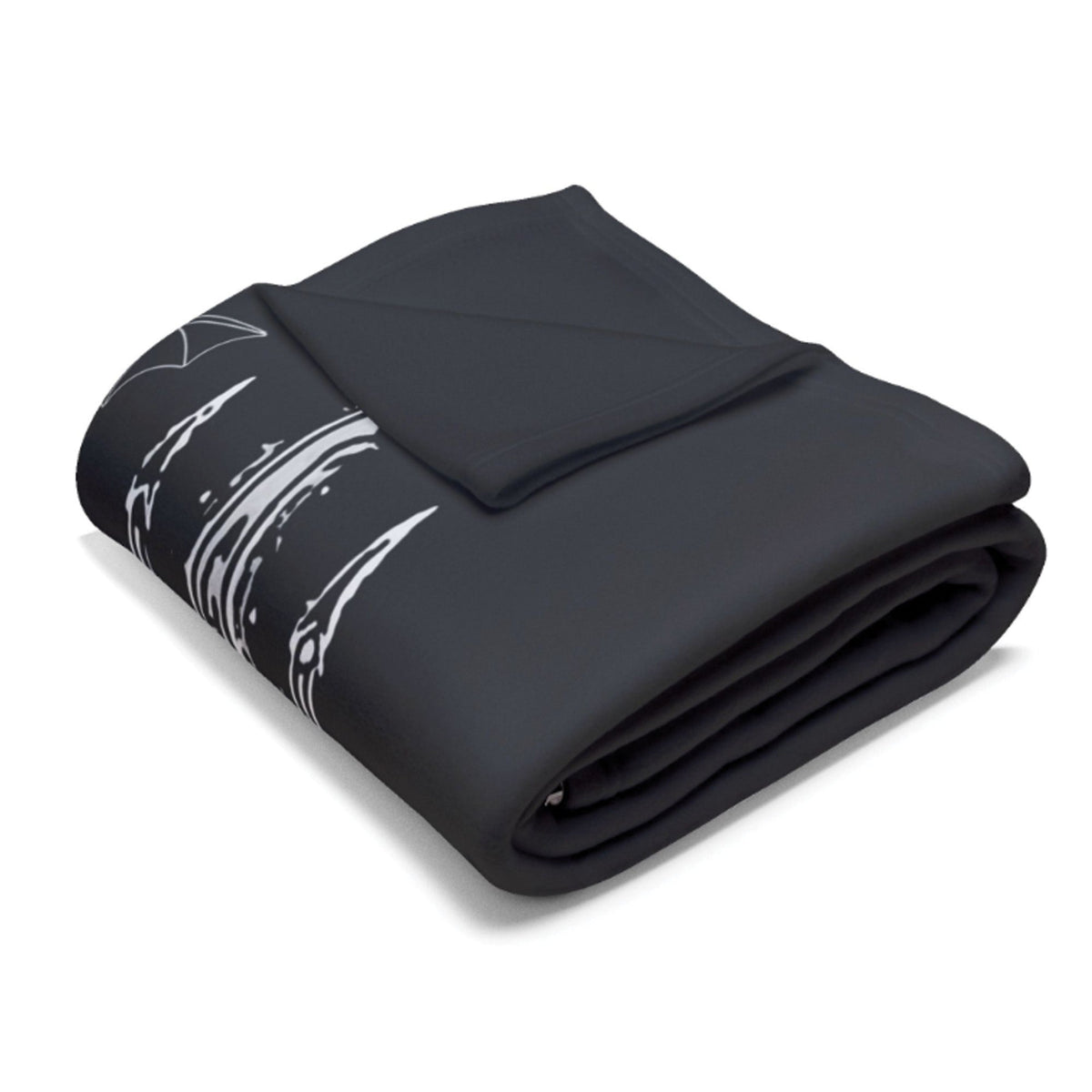 A folded black blanket featuring a white abstract brushstroke pattern on one side, displayed on a clean white background.