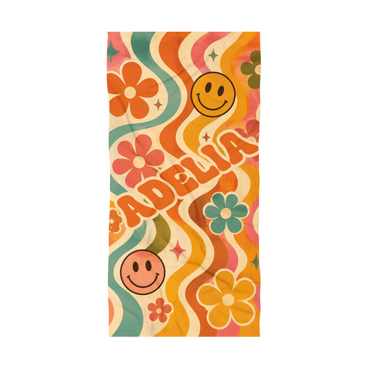 Colorful Orange beach towel with teal with teal waves with smily faces, orange and teal flowers on cream background