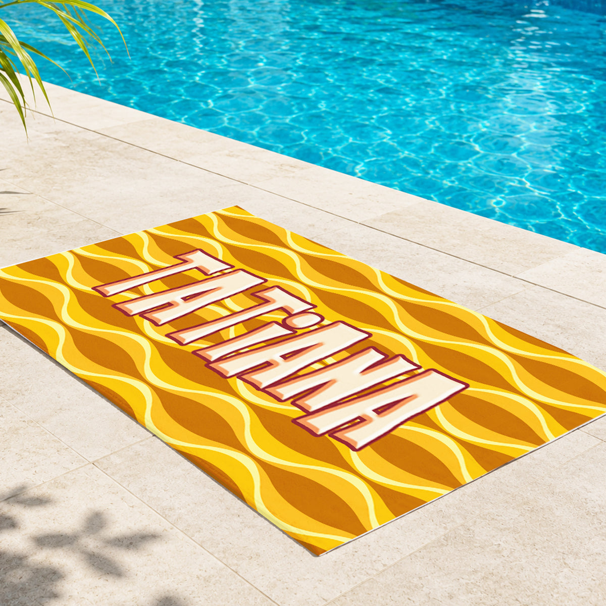 A rectangular beach towel featuring a retro wavy pattern in navy blue, pink, and peach, with the name 'MARLY' printed vertically in large beige block letters with a red outline.