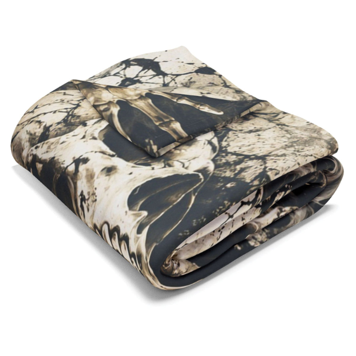 A folded blanket with an abstract paint-splatter camouflage pattern in black, beige, and brown, shown on a clean white background.