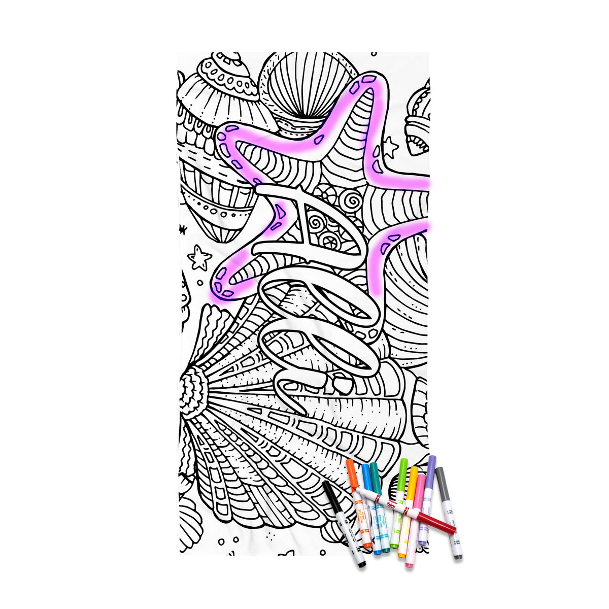 May include: A white rectangular beach towel featuring a black line art design of various seashells and the word BEACH printed in large block letters. The towel is scattered with several colorful markers used for coloring the printed illustrations.