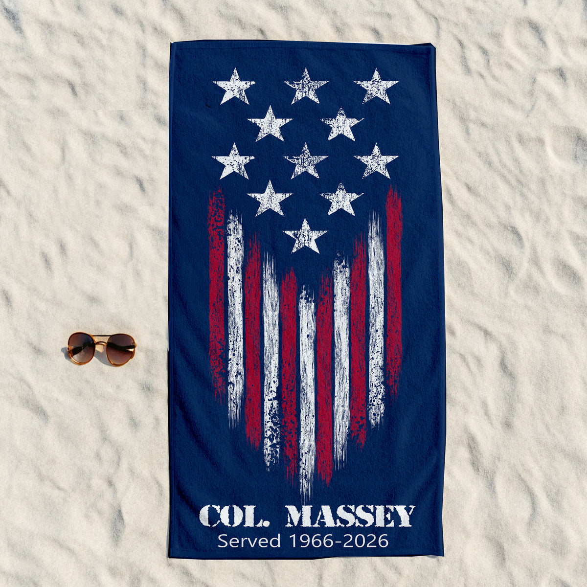 navy blue towel with white starts with white and red stripes with col massey underneath  with date served 1966-2026