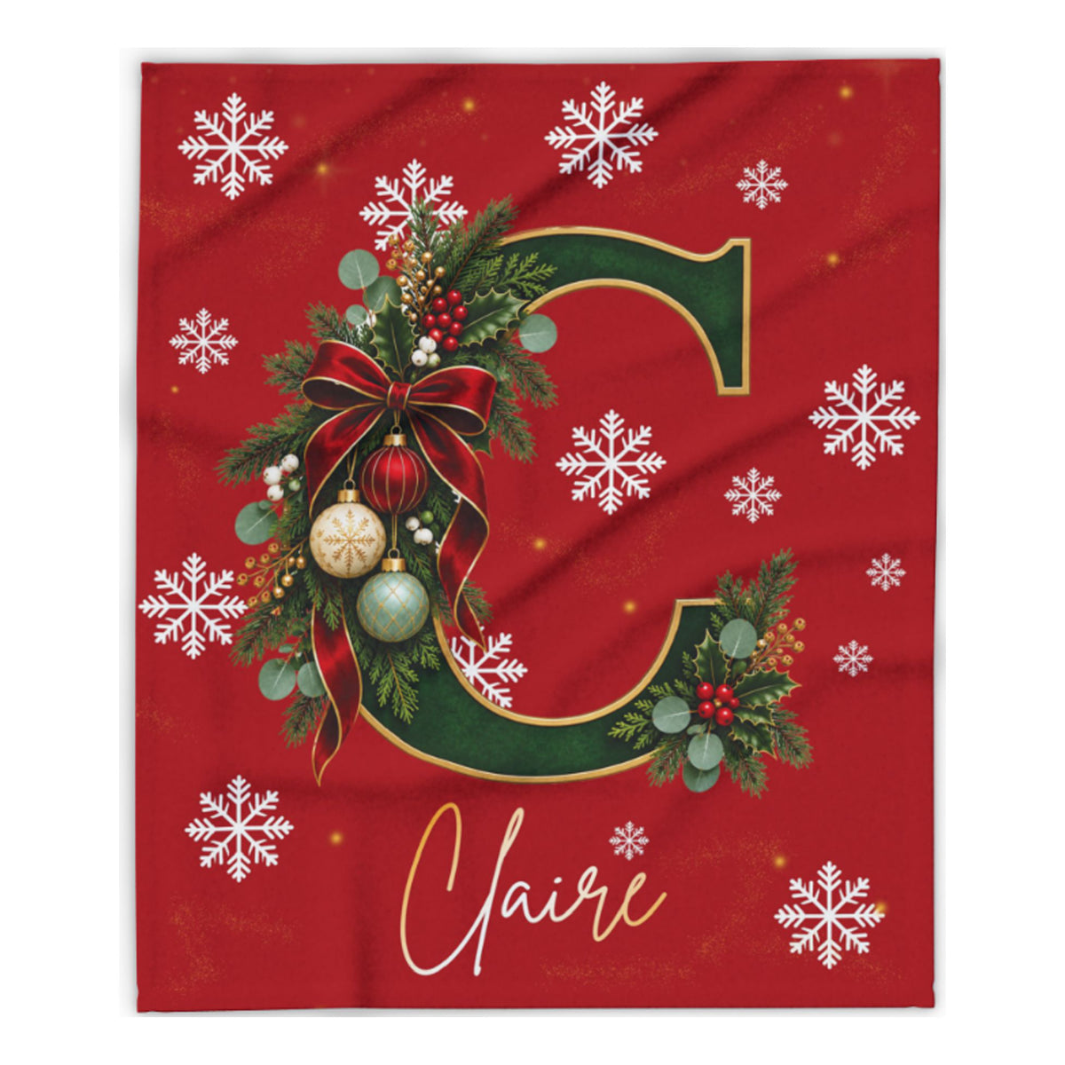 A red holiday-themed personalized blanket or fabric print featuring a large green letter C decorated with a red bow, green foliage, ornaments, and white snowflakes, with the name 'Claire' in white script at the bottom.