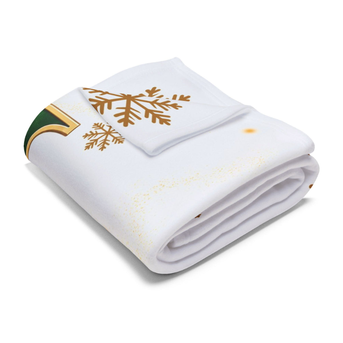 A folded white blanket featuring a gold snowflake design and a green and gold decorative accent on the corner, set against a plain white background.